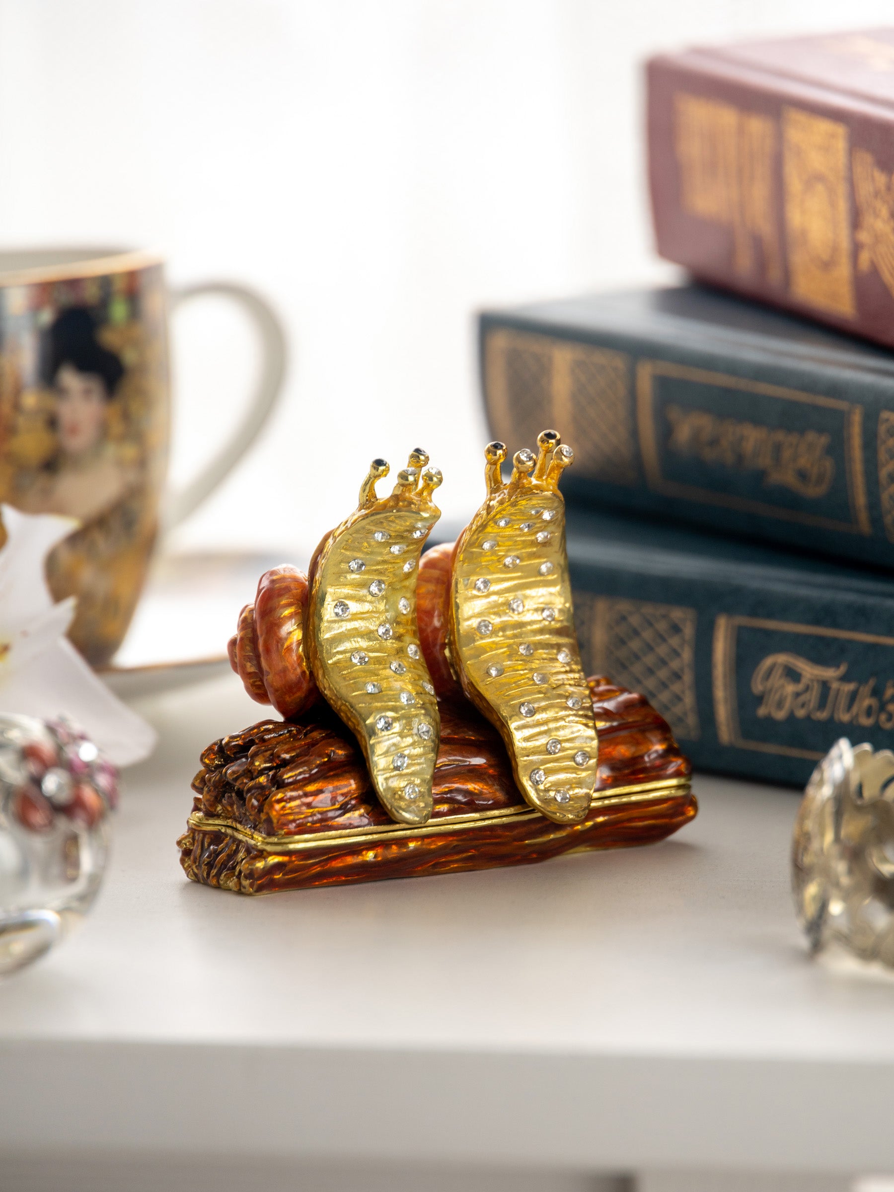 Keren Kopal Snails Sitting on a Log