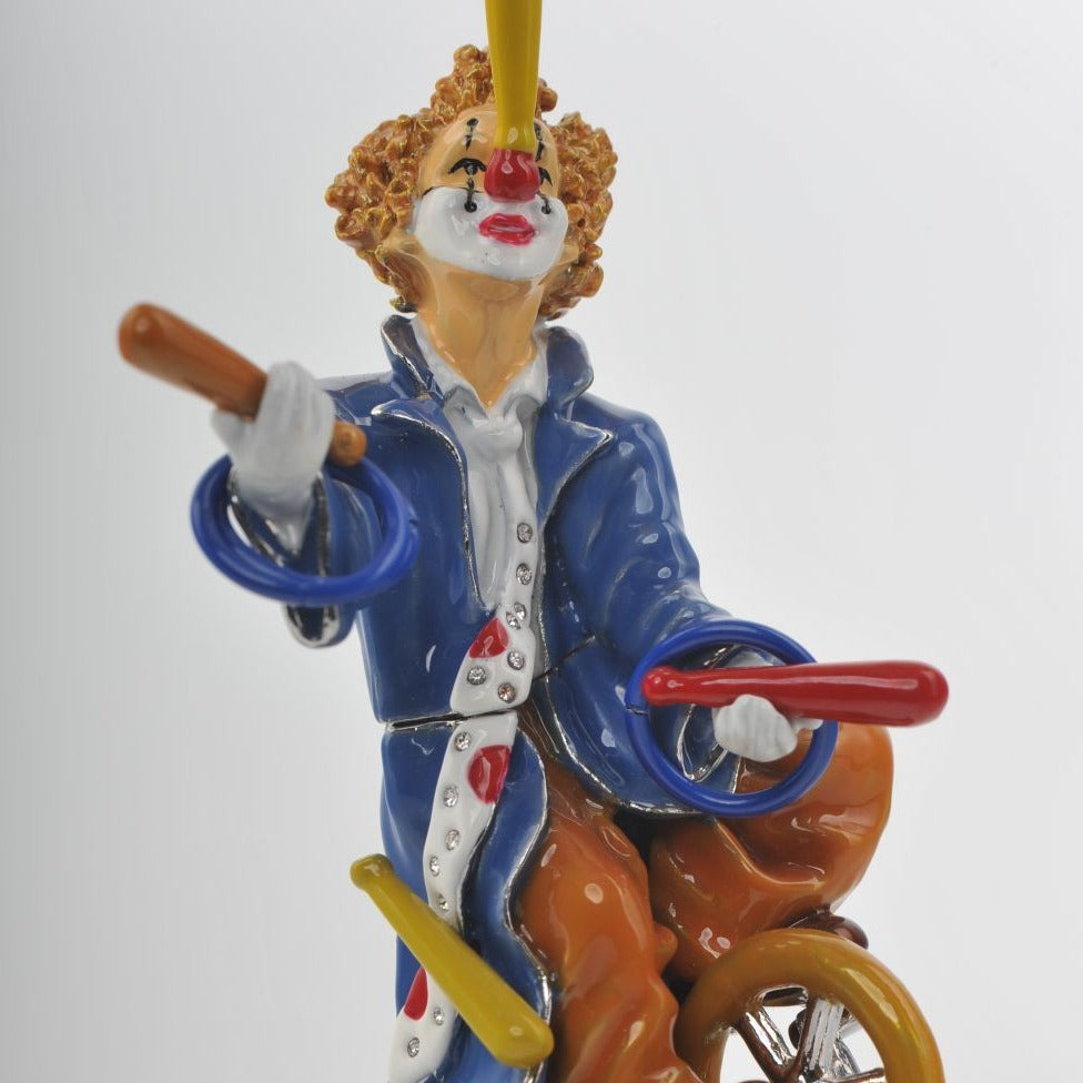 Keren Kopal Circus Clown Juggles on a Unicycle