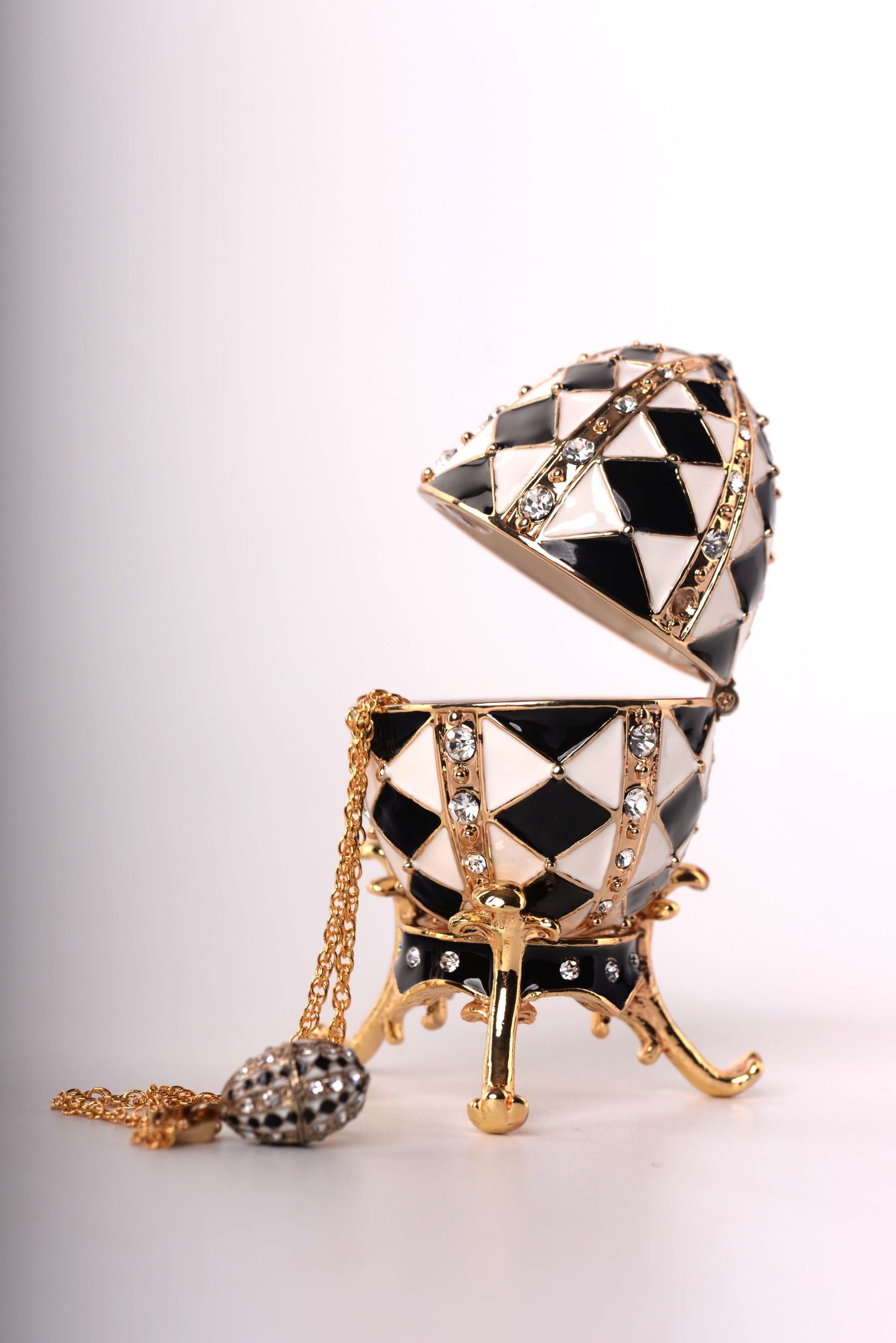 Keren Kopal Black and White Faberge Egg with Gold Necklace Inside