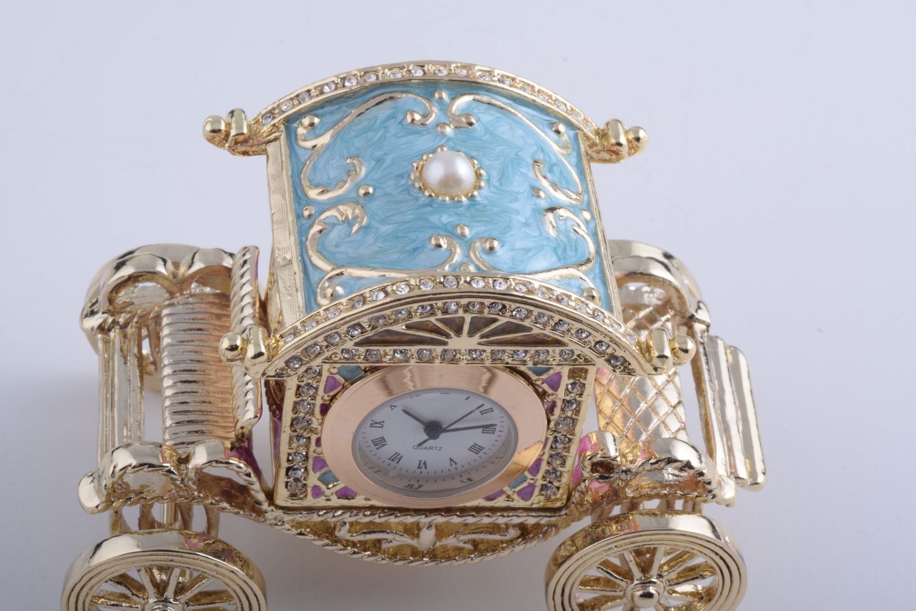 Keren Kopal Gold Carriage with a Clock
