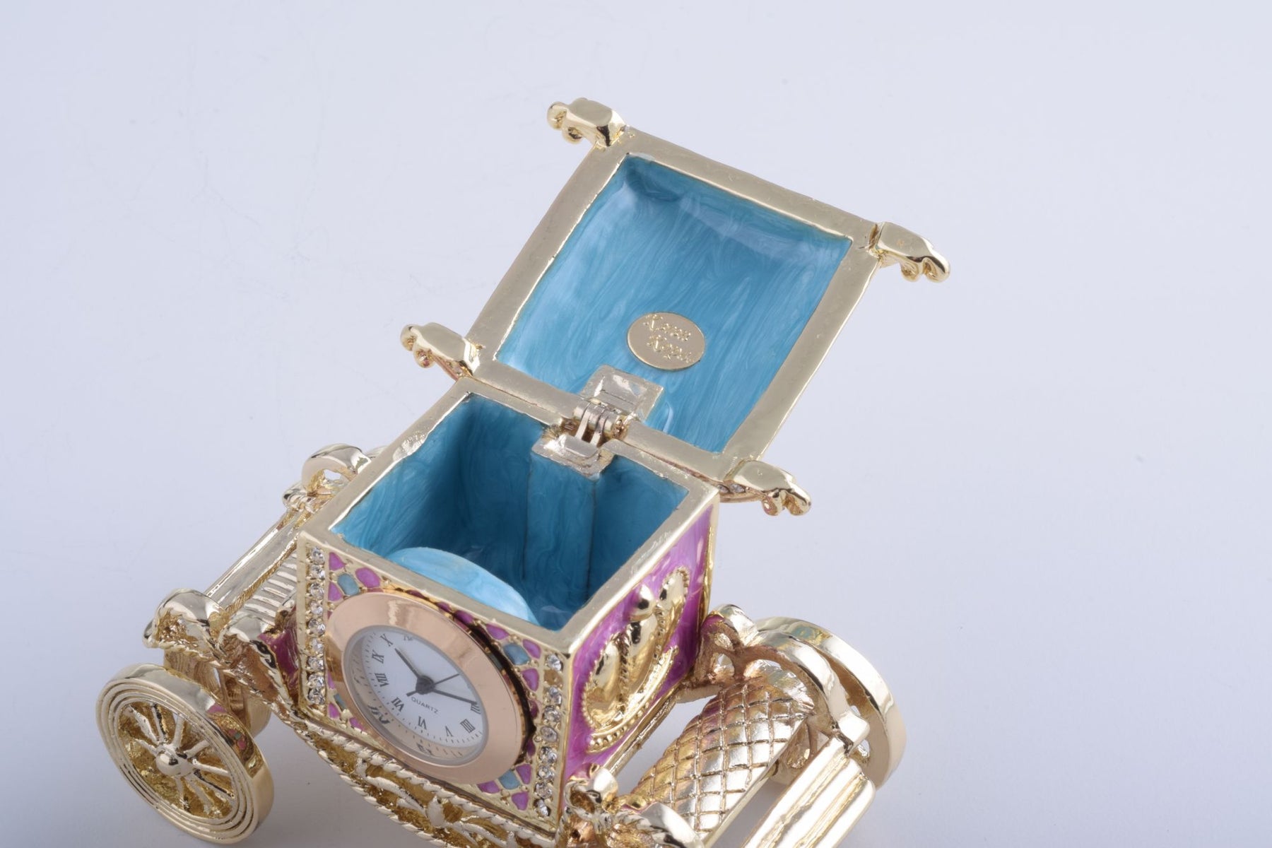 Keren Kopal Gold Carriage with a Clock