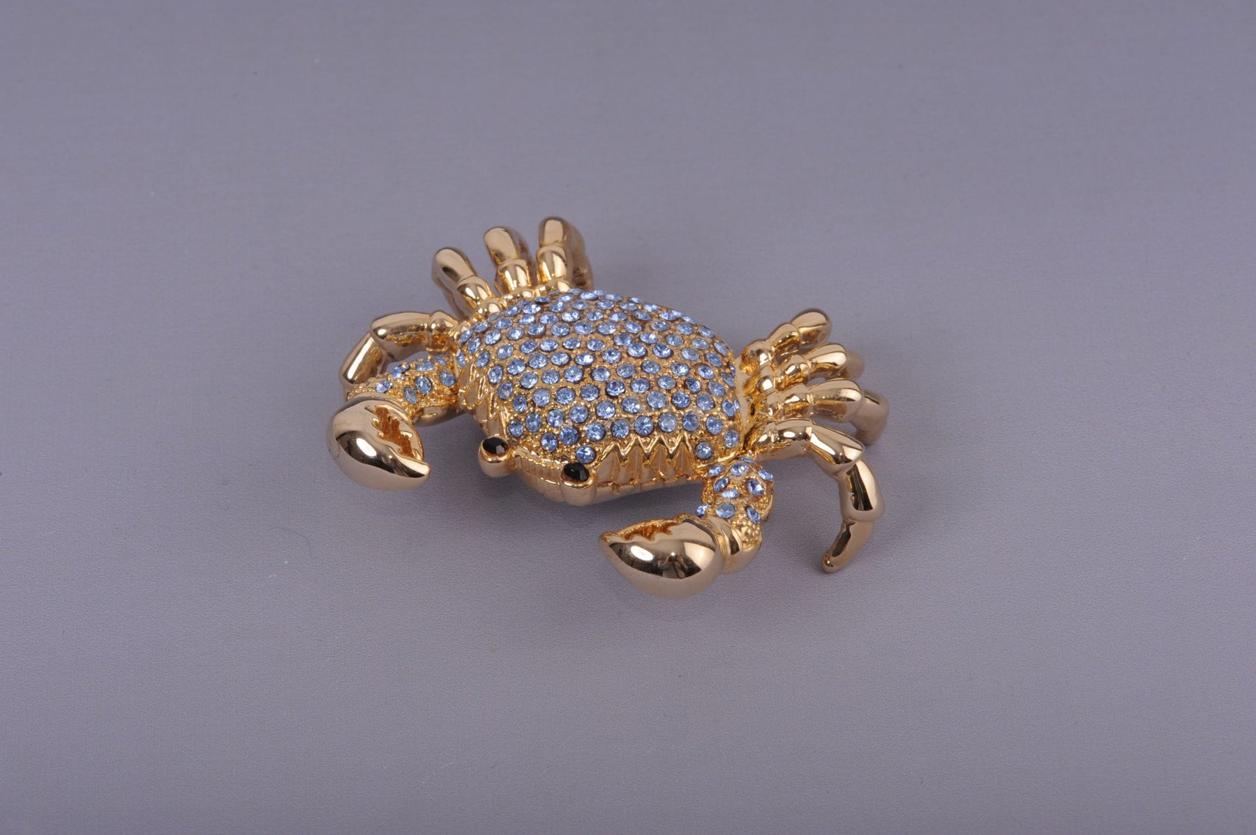 Golden Crab with blue stones