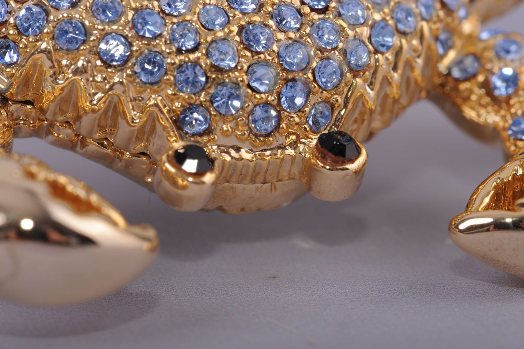 Golden Crab with blue stones