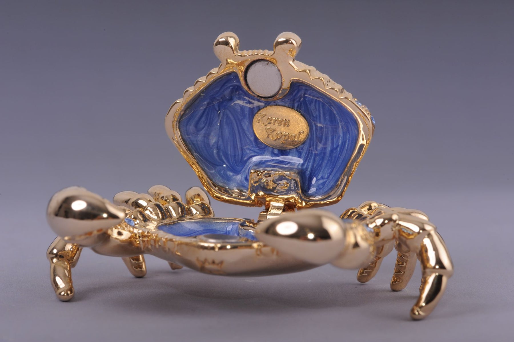 Golden Crab with blue stones