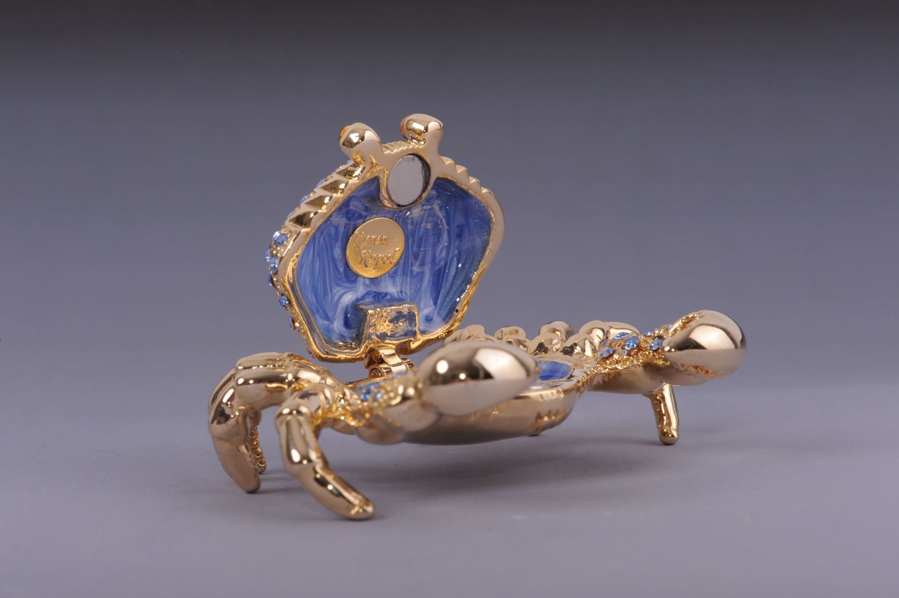 Golden Crab with blue stones