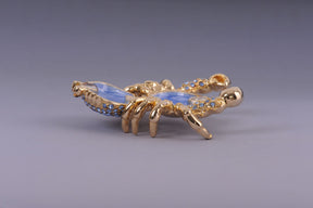 Golden Crab with blue stones