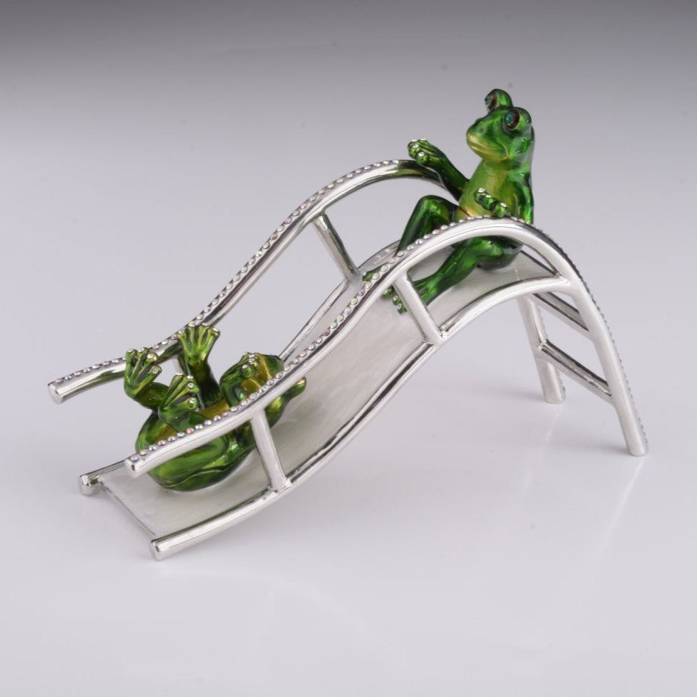 Two Frogs Riding Slide